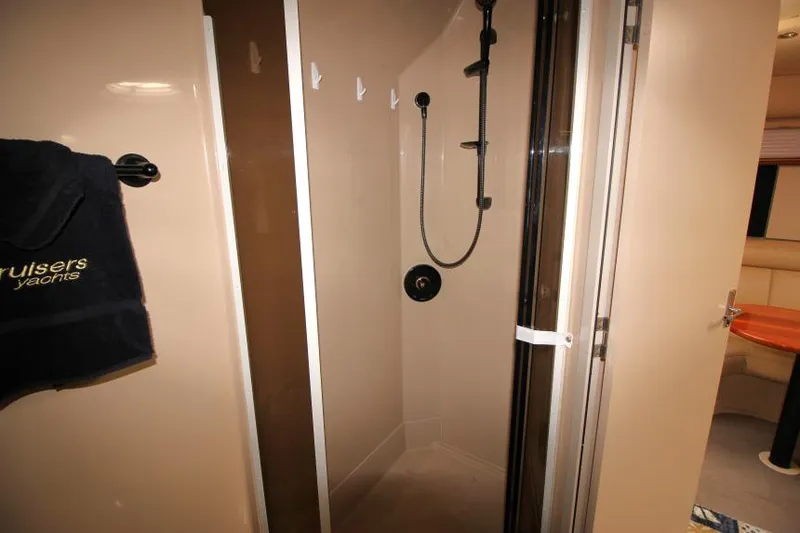 Slide: The Image of Shower area in 2000 Cruisers Yachts 3870 Express, featuring modern fixtures and sleek design. - 23