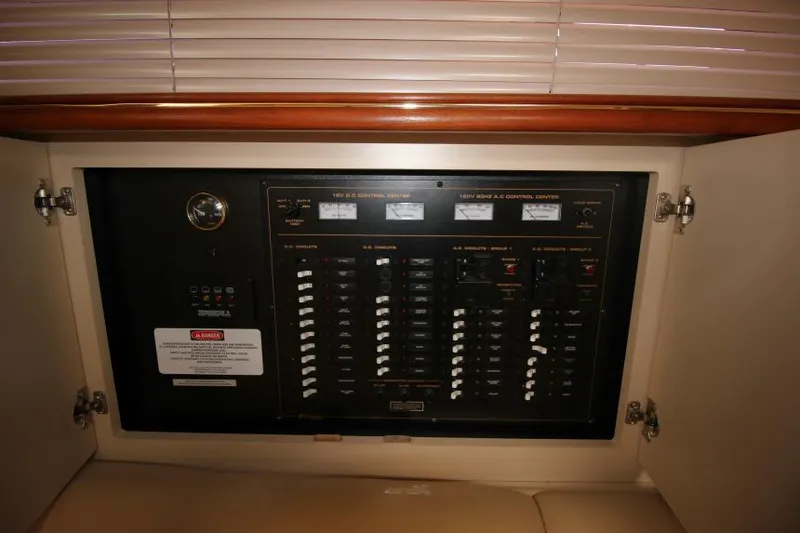 Slide: The Image of Electrical control panel inside a 2000 Cruisers Yachts 3870 Express boat. - 26