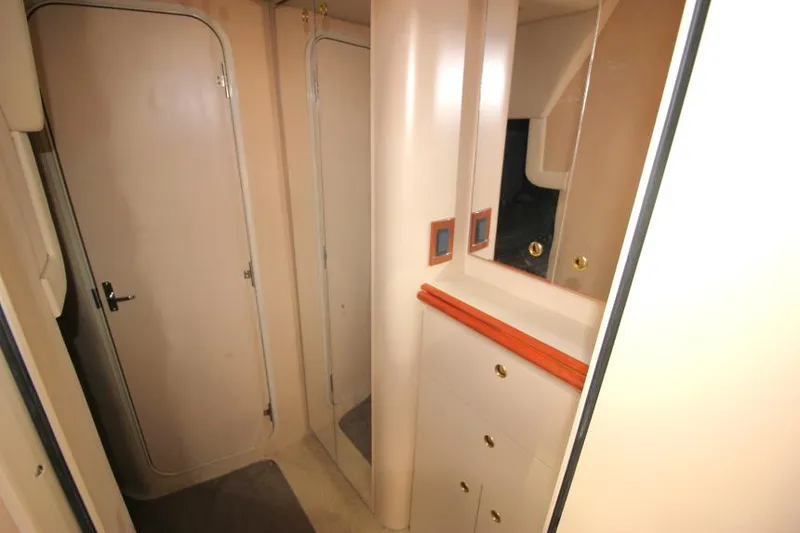 Slide: The Image of Interior of 2000 Cruisers Yachts 3870 Express, featuring cabinetry and doors. - 30