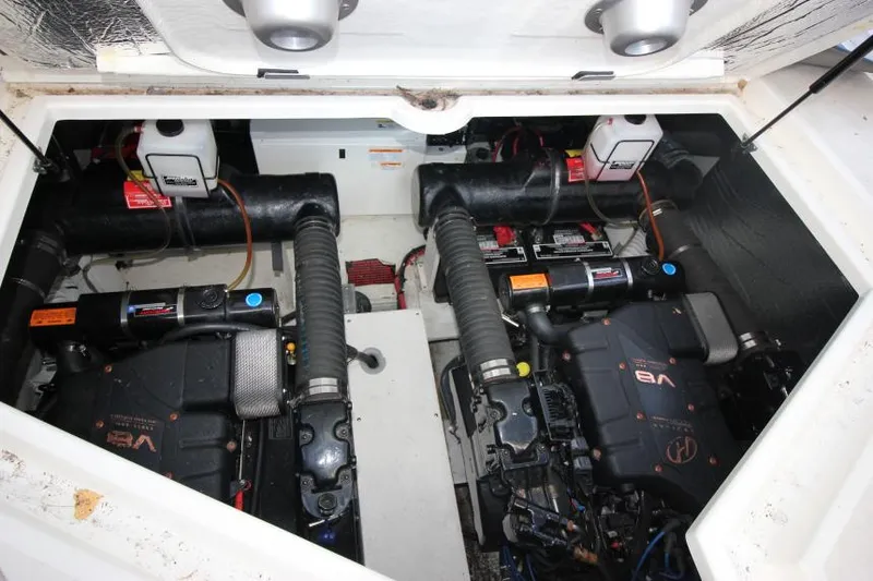 Slide: The Image of Engine compartment of 2000 Cruisers Yachts 3870 Express, featuring dual V8 engines. - 34