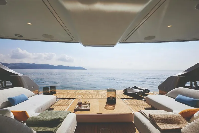 Slide: The Image of Luxurious 2023 Azimut Trideck yacht deck with ocean view and comfortable seating. - 10
