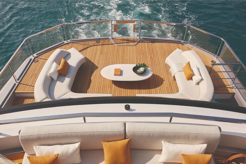 Slide: The Image of Luxury deck of 2023 Azimut Trideck yacht with elegant seating and ocean view. - 12