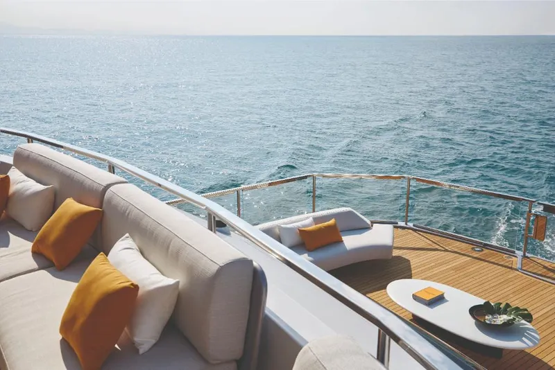 Slide: The Image of Luxury deck of 2023 Azimut Trideck yacht with ocean view and comfortable seating. - 15