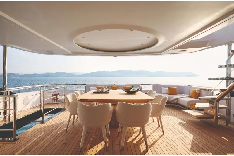 Slide: The Image of Luxury deck of 2023 Azimut Trideck yacht with dining area and ocean view. - 16