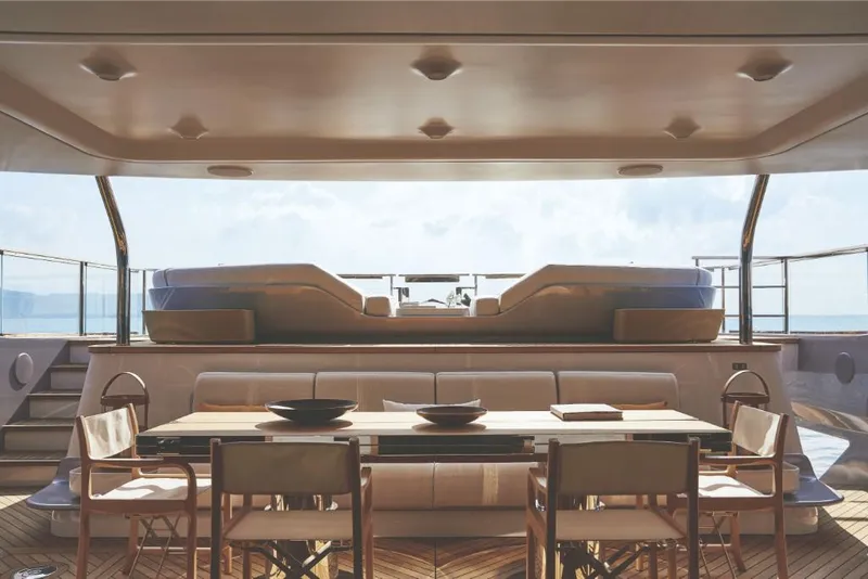 Slide: The Image of Luxury deck of 2023 Azimut Trideck yacht with dining area and hot tub. - 18