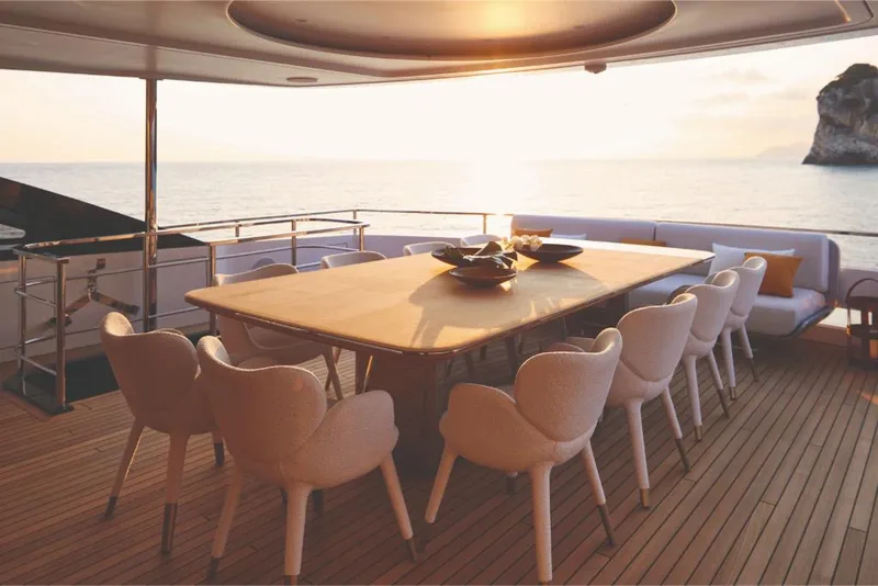 Slide: The Image of Luxury dining area on 2023 Azimut Trideck yacht at sunset. - 19
