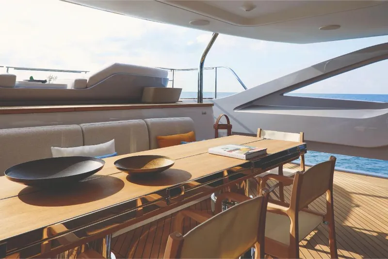 Slide: The Image of Luxurious dining area on the 2023 Azimut Trideck yacht with ocean view. - 21