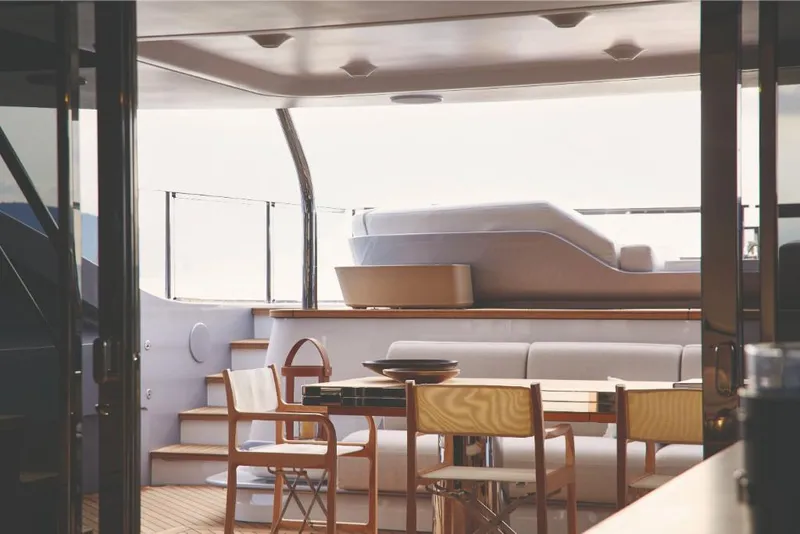 Slide: The Image of Luxurious interior of 2023 Azimut Trideck yacht with modern seating and dining area. - 22