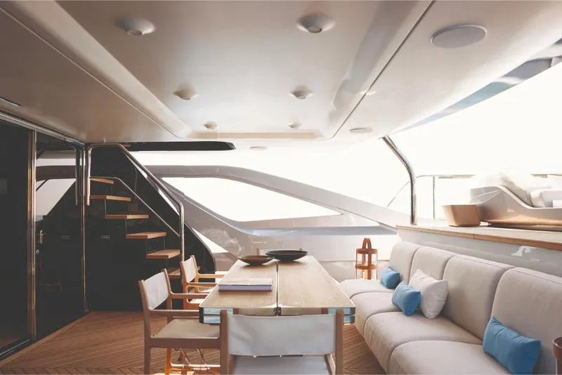 Slide: The Image of Luxurious interior of 2023 Azimut Trideck yacht with modern seating and dining area. - 23