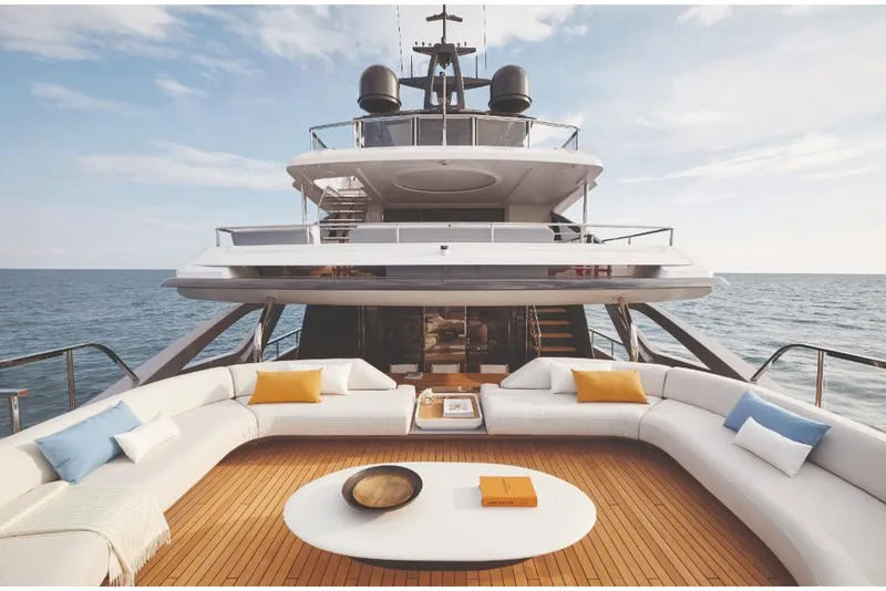 Slide: The Image of Luxurious 2023 Azimut Trideck yacht with spacious outdoor seating area on the ocean. - 25