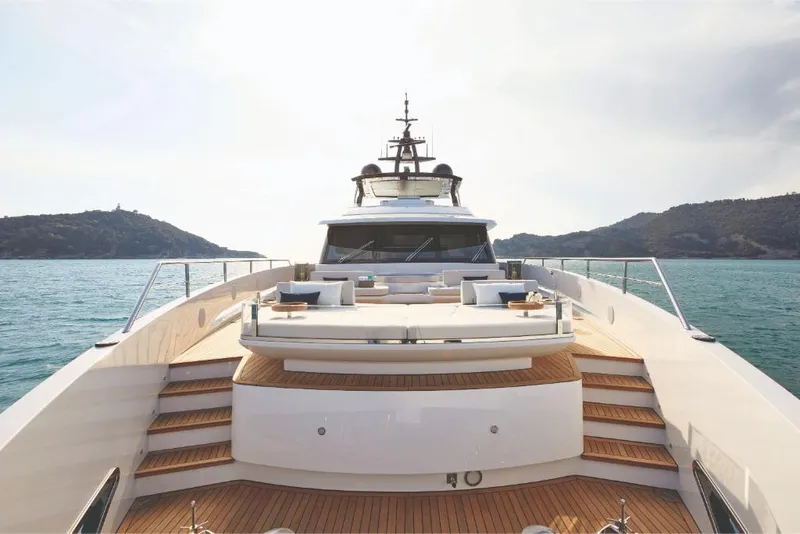 Slide: The Image of 2023 Azimut Trideck luxury yacht on open water with scenic mountain backdrop. - 26