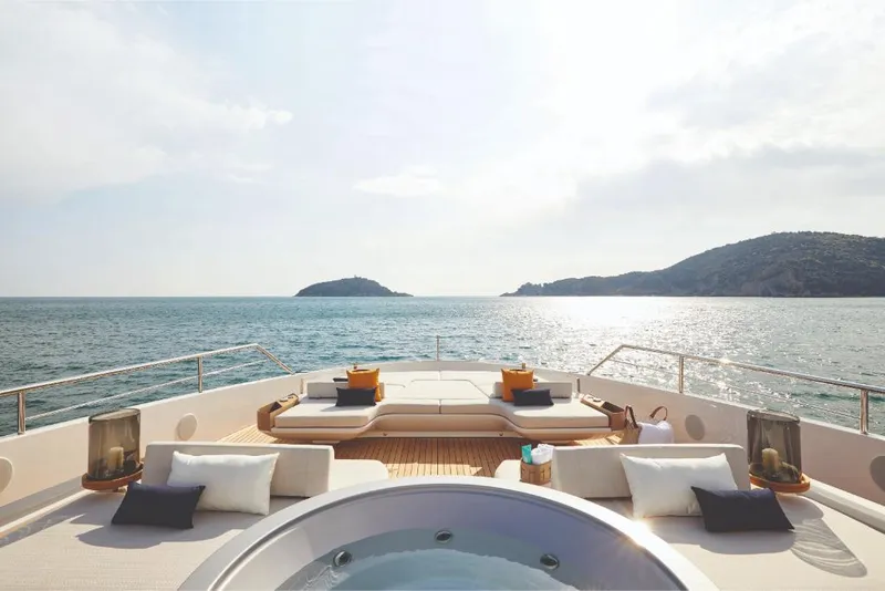 Slide: The Image of Luxury deck of 2023 Azimut Trideck yacht with jacuzzi and ocean view. - 27