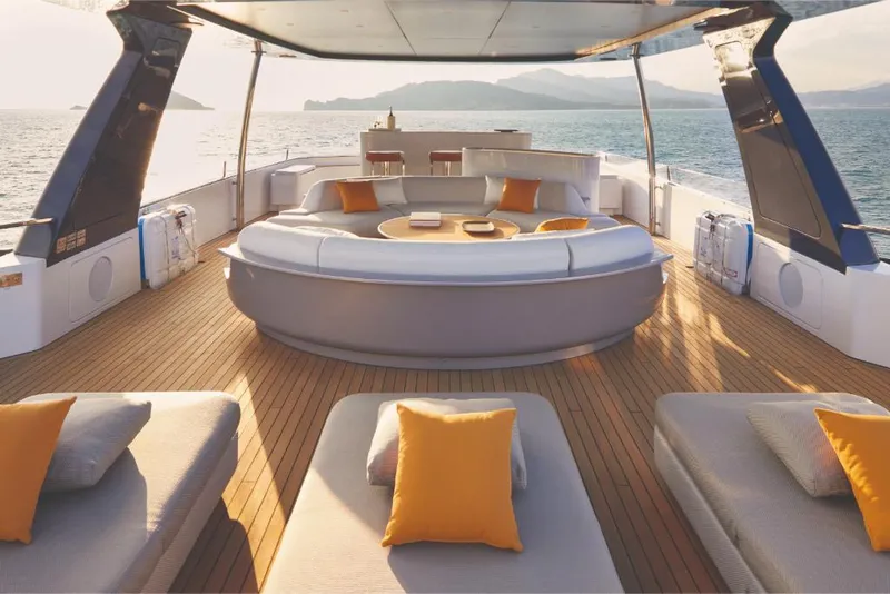 Slide: The Image of Luxurious deck of 2023 Azimut Trideck yacht with sun loungers and scenic ocean view. - 29