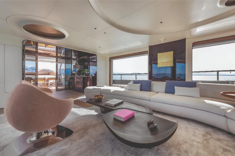 Slide: The Image of Luxurious interior of 2023 Azimut Trideck yacht with modern furnishings and panoramic windows. - 31