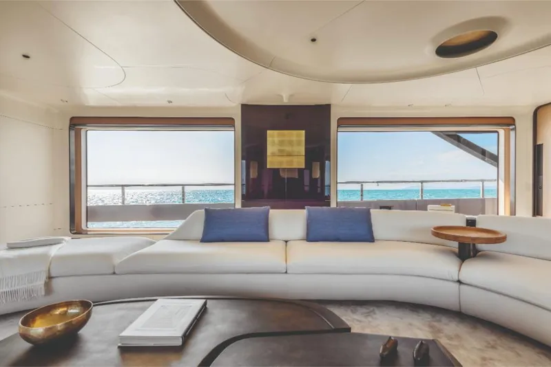 Slide: The Image of Luxurious interior of 2023 Azimut Trideck yacht with ocean view through large windows. - 32