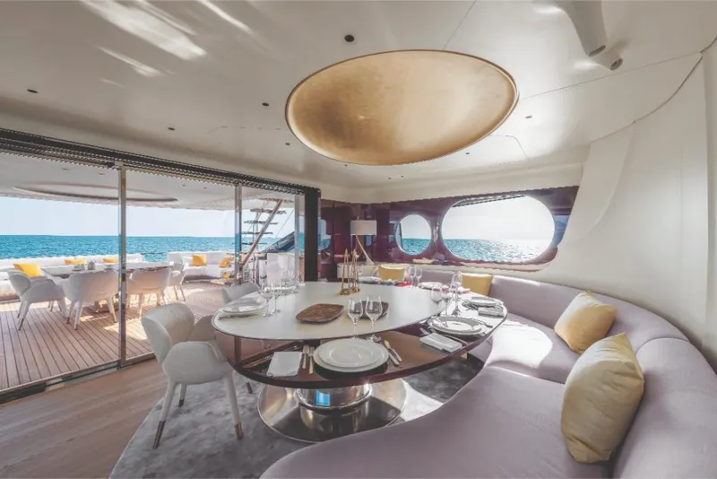 Slide: The Image of Luxurious dining area on 2023 Azimut Trideck yacht with ocean view. - 37