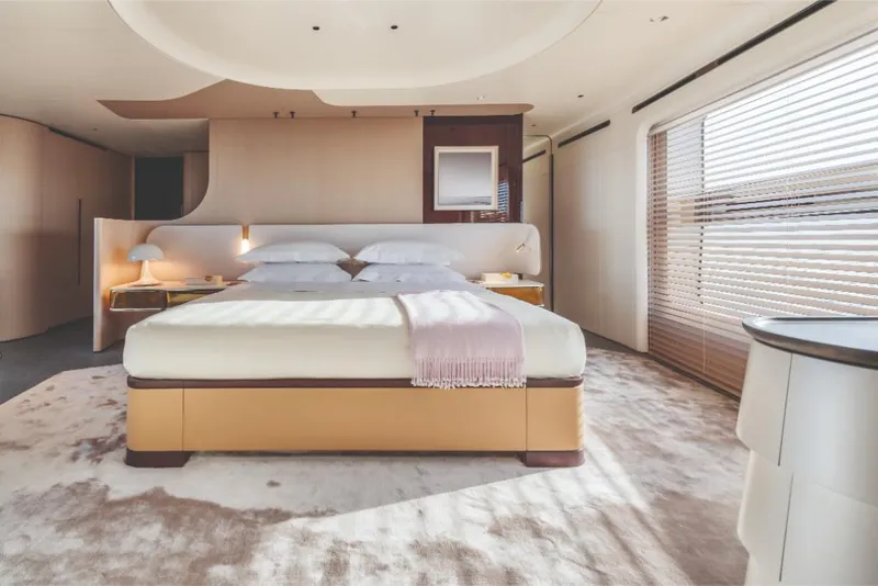 Slide: The Image of Luxurious bedroom interior of 2023 Azimut Trideck yacht with modern design and large windows. - 43
