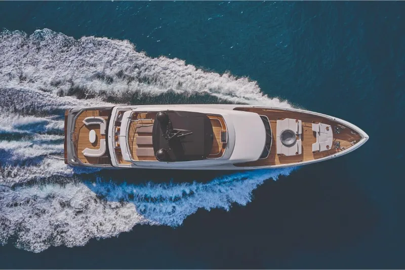 Slide: The Image of Aerial view of 2023 Azimut Trideck yacht cruising on the ocean. - 5