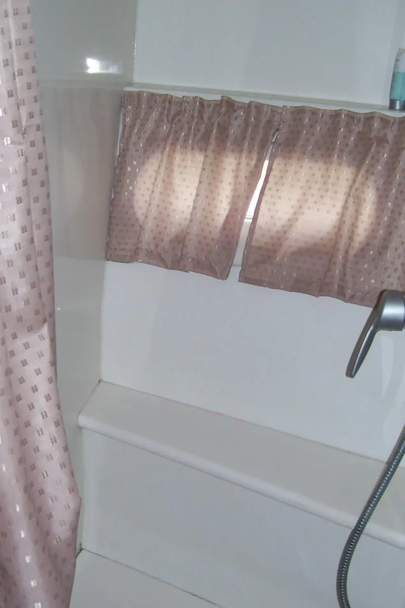 Slide: The Image of Shower area in 2007 Carver 43 Motor Yacht with pink curtains. - 26