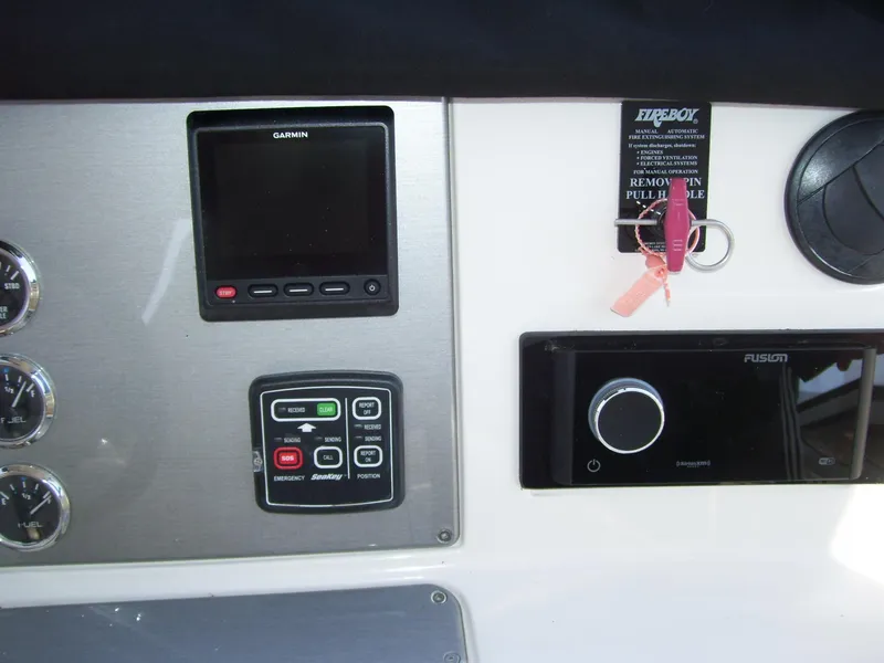 Slide: The Image of Control panel of 2007 Carver 43 Motor Yacht with Garmin and Fusion systems. - 28