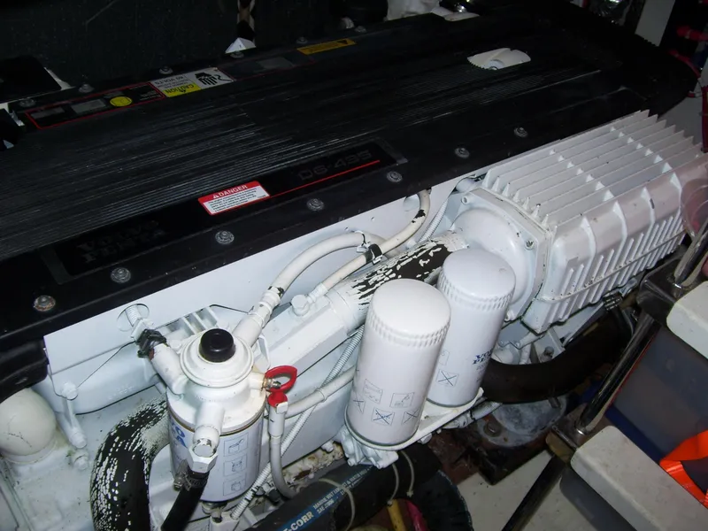 Slide: The Image of Engine compartment of a 2007 Carver 43 Motor Yacht, showcasing detailed components. - 29
