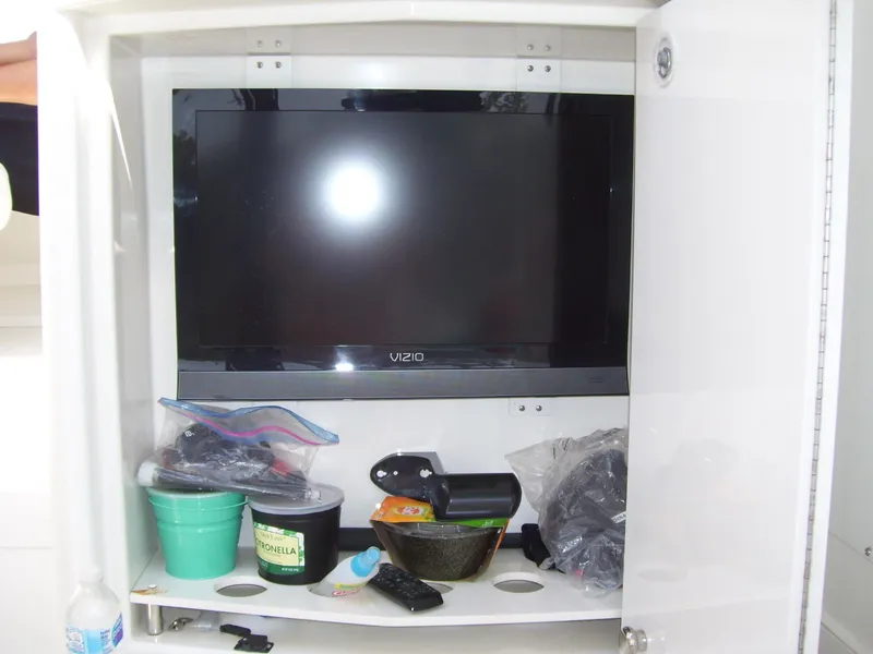 Slide: The Image of Cabinet with Vizio TV and assorted items on Carver 43 Motor Yacht, 2007 model. - 7