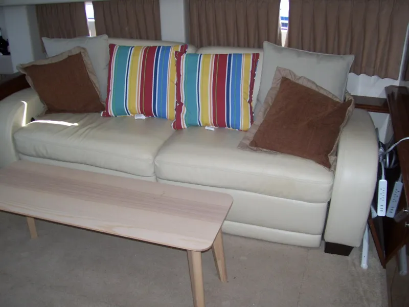 Slide: The Image of Beige sofa with colorful striped and brown pillows in Carver 43 Motor Yacht, 2007. - 18