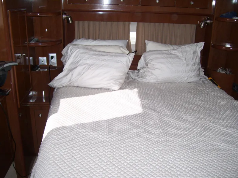 Slide: The Image of Interior cabin of 2007 Carver 43 Motor Yacht with bed and pillows. - 21