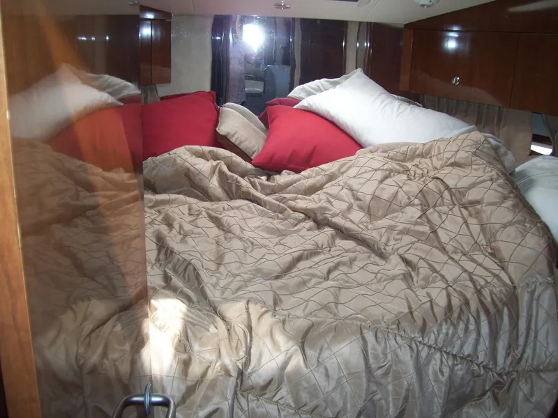 Slide: The Image of Luxurious bedroom interior of 2007 Carver 43 Motor Yacht with plush bedding. - 23