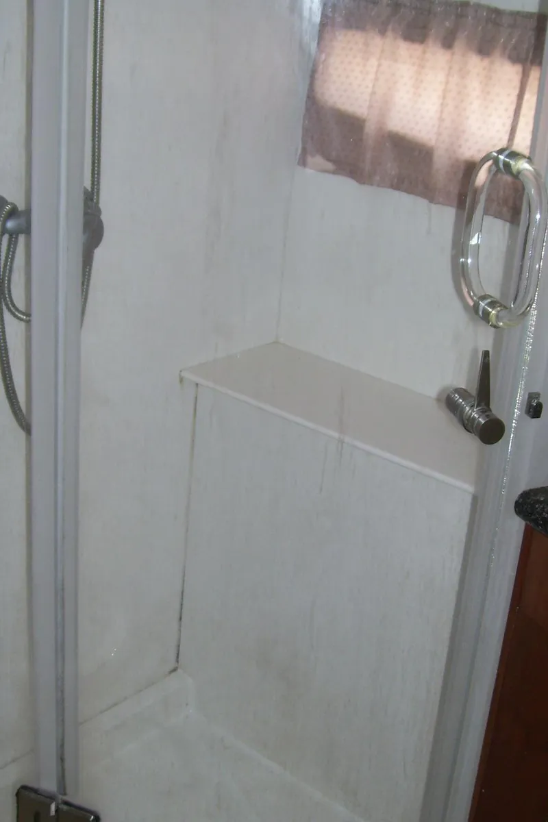 Slide: The Image of Shower area in 2007 Carver 43 Motor Yacht with glass door and chrome fixtures. - 25