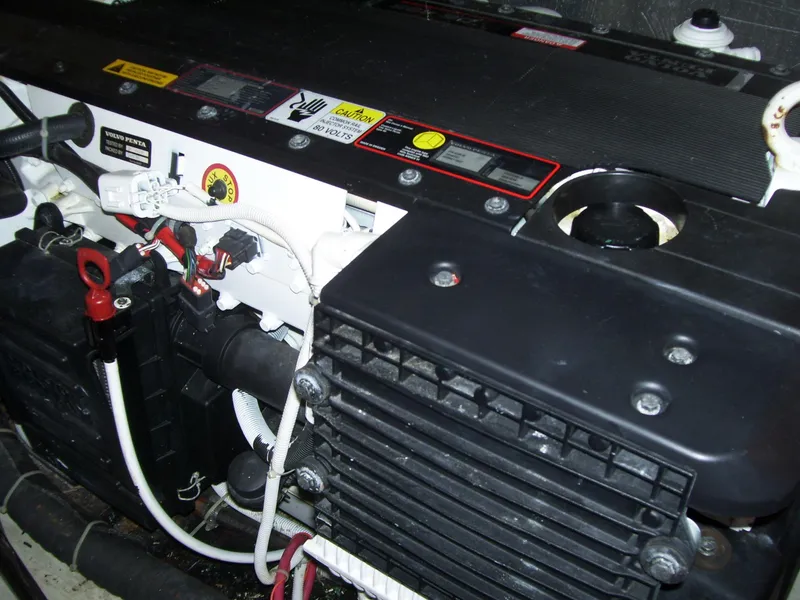 Slide: The Image of Engine compartment of a 2007 Carver 43 Motor Yacht, showcasing mechanical components and wiring. - 30