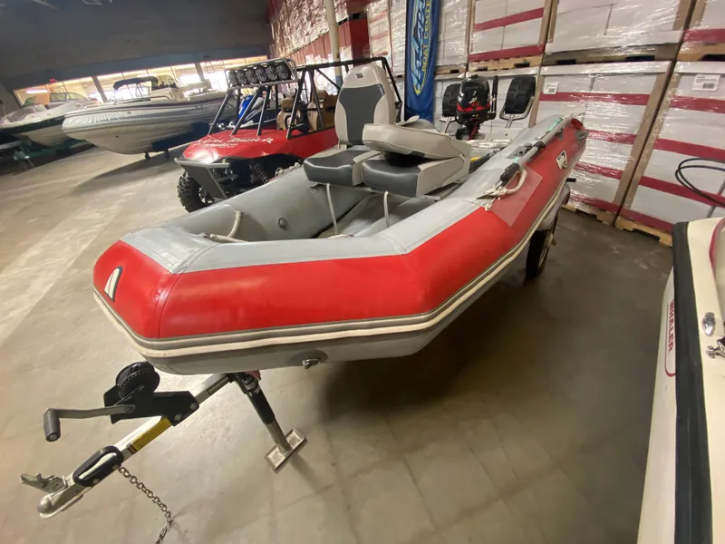 Slide: The Image of 2006 Achilles LSI-112 inflatable boat in storage facility. - 6