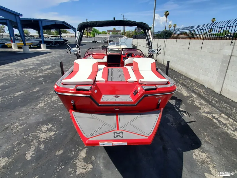 Slide: The Image of 2022 Heyday WT-2DC boat, red and white, parked outdoors on a sunny day. - 12