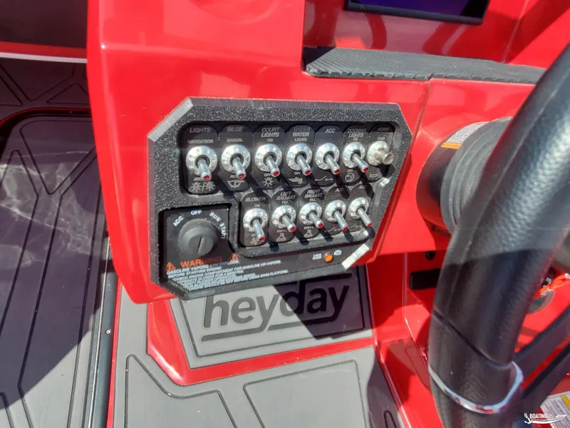 Slide: The Image of Control panel of 2022 Heyday WT-2DC boat with switches and steering wheel. - 15