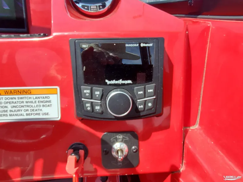 Slide: The Image of 2022 Heyday WT-2DC boat dashboard with Rockford Fosgate audio system and safety warning label. - 16