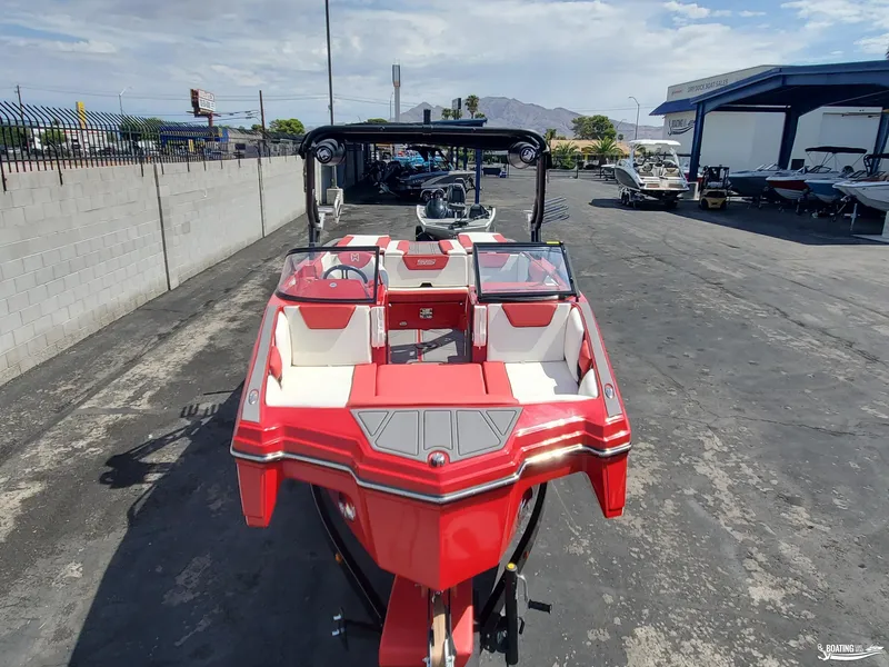 Slide: The Image of Red 2022 Heyday WT-2DC boat parked in a dealership lot. - 3