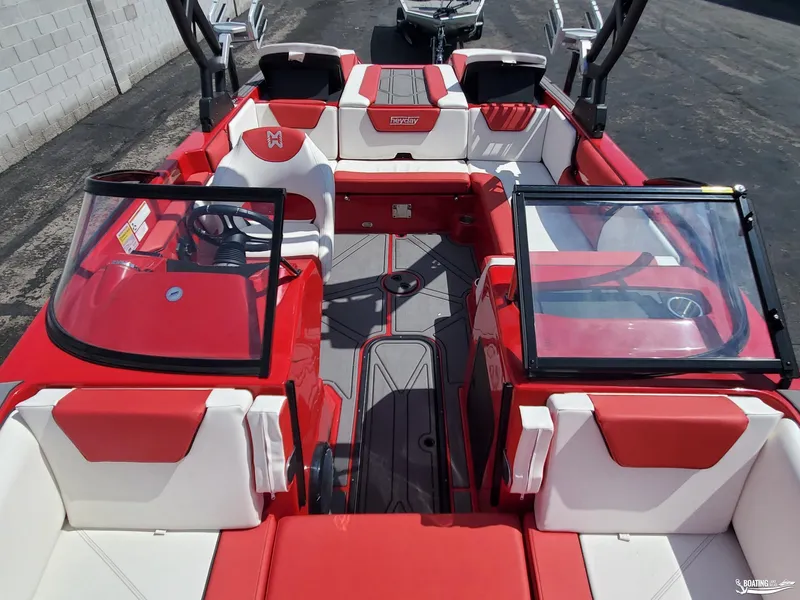 Slide: The Image of 2022 Heyday WT-2DC boat interior with red and white seating, dual windshields, and modern design. - 7
