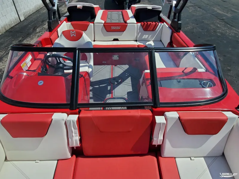 Slide: The Image of 2022 Heyday WT-2DC boat interior with red and white seating and windshield. - 8