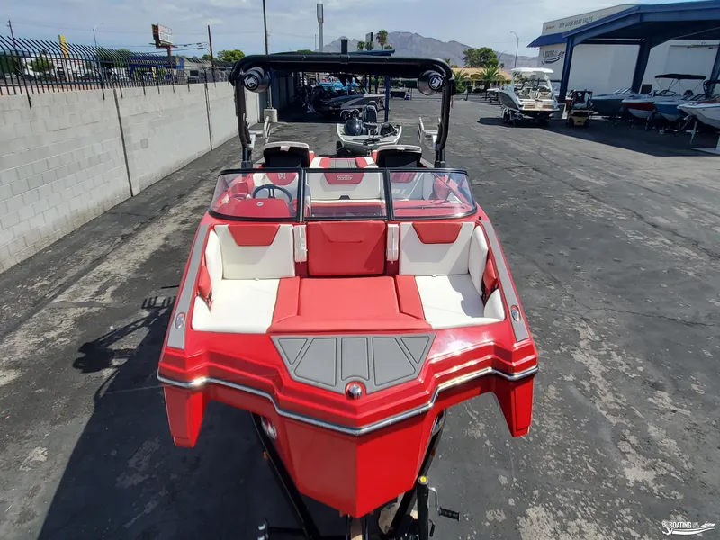 Slide: The Image of Red 2022 Heyday WT-2DC boat with white interior, parked outdoors. - 9