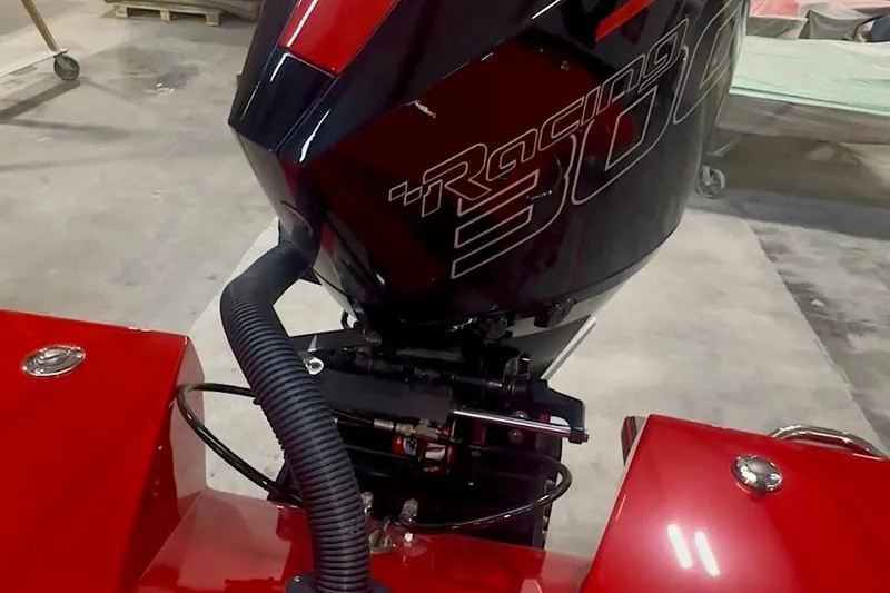Slide: The Image of Velocity 22 Punisher 2026 boat with Racing 300 engine, red and black design. - 13
