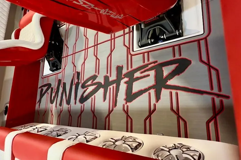 Slide: The Image of Red and silver interior of 2026 Velocity 22 Punisher boat with bold "Punisher" text. - 6