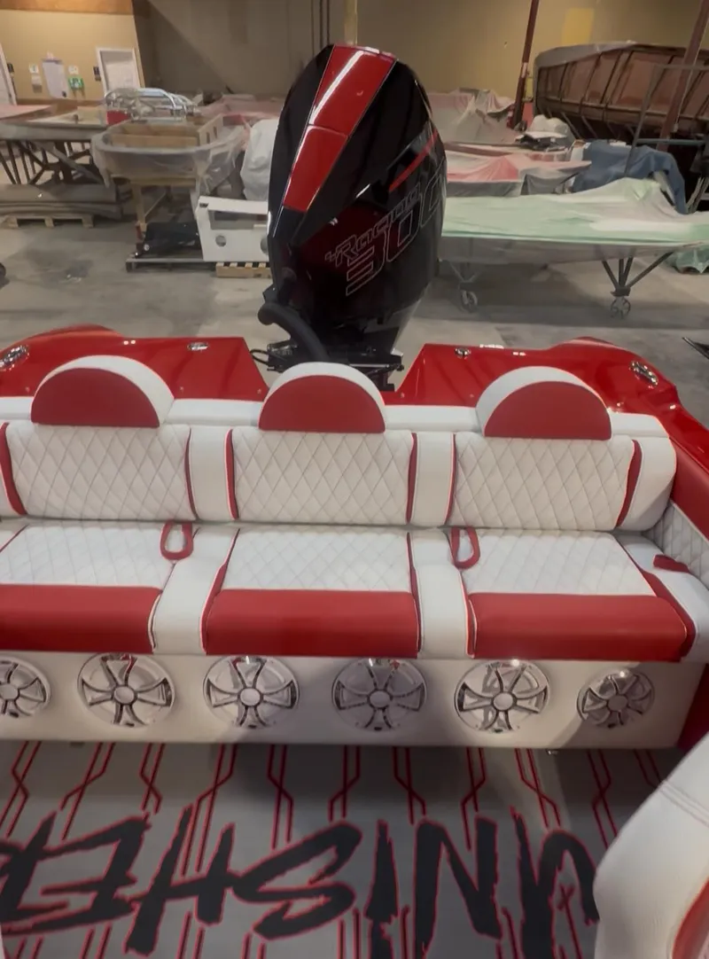 Slide: The Image of Red and white Velocity 22 Punisher boat interior with powerful engine, 2026 model. - 7