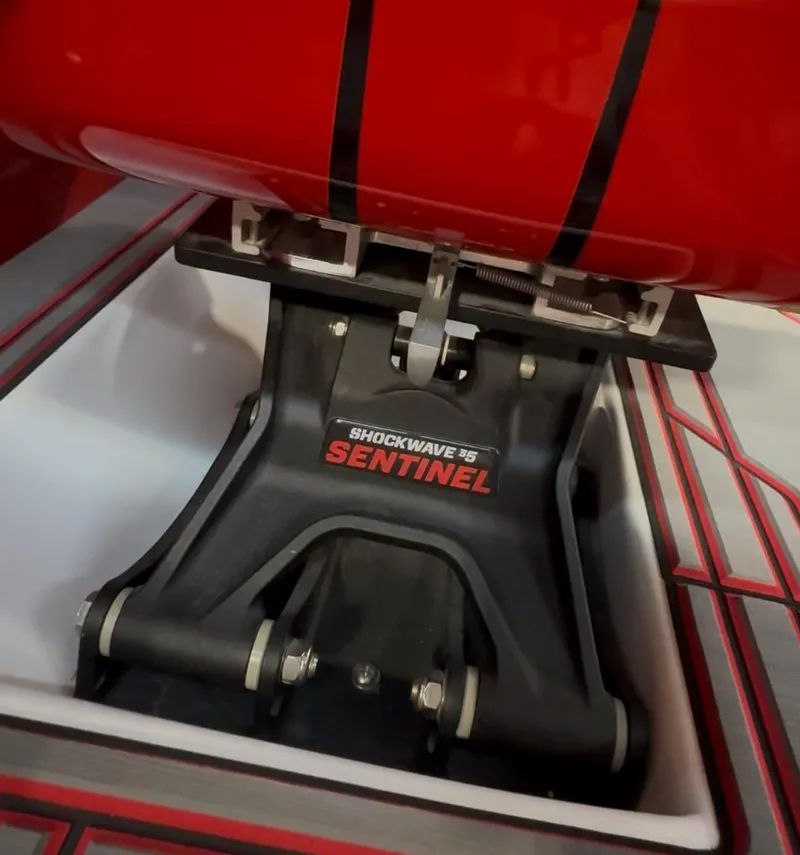 Slide: The Image of Shockwave 95 Sentinel mount in Velocity 22 Punisher, 2026 model, with red and black design. - 8