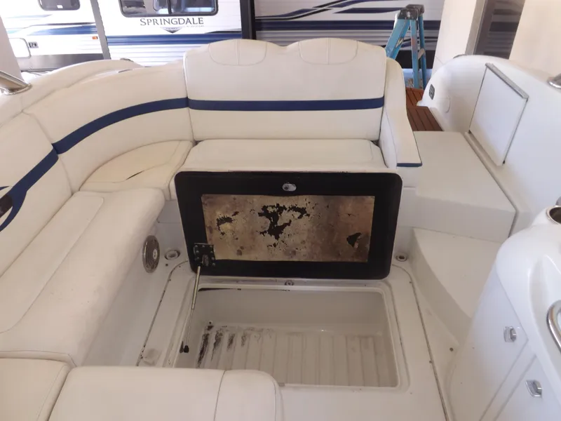 Slide: The Image of 2008 Formula 310 Bowrider interior seating with storage compartment open. - 10