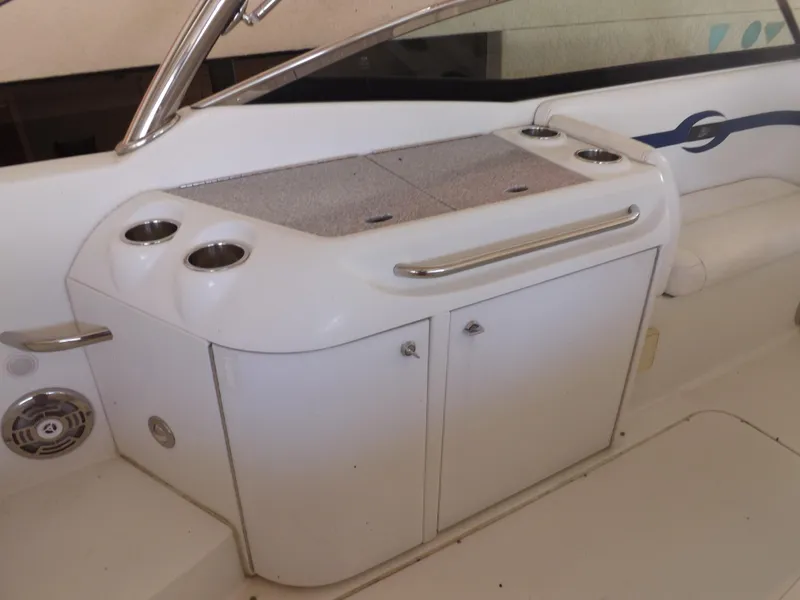 Slide: The Image of 2008 Formula 310 Bowrider boat interior with storage and cup holders. - 11
