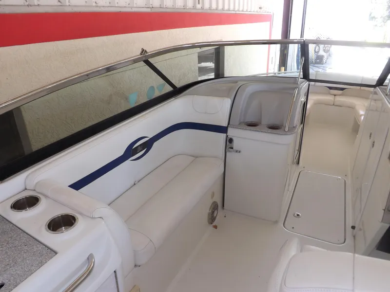 Slide: The Image of 2008 Formula 310 Bowrider interior with white seating and blue accents. - 13