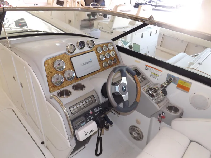 Slide: The Image of 2008 Formula 310 Bowrider helm with Garmin navigation system and modern controls. - 17