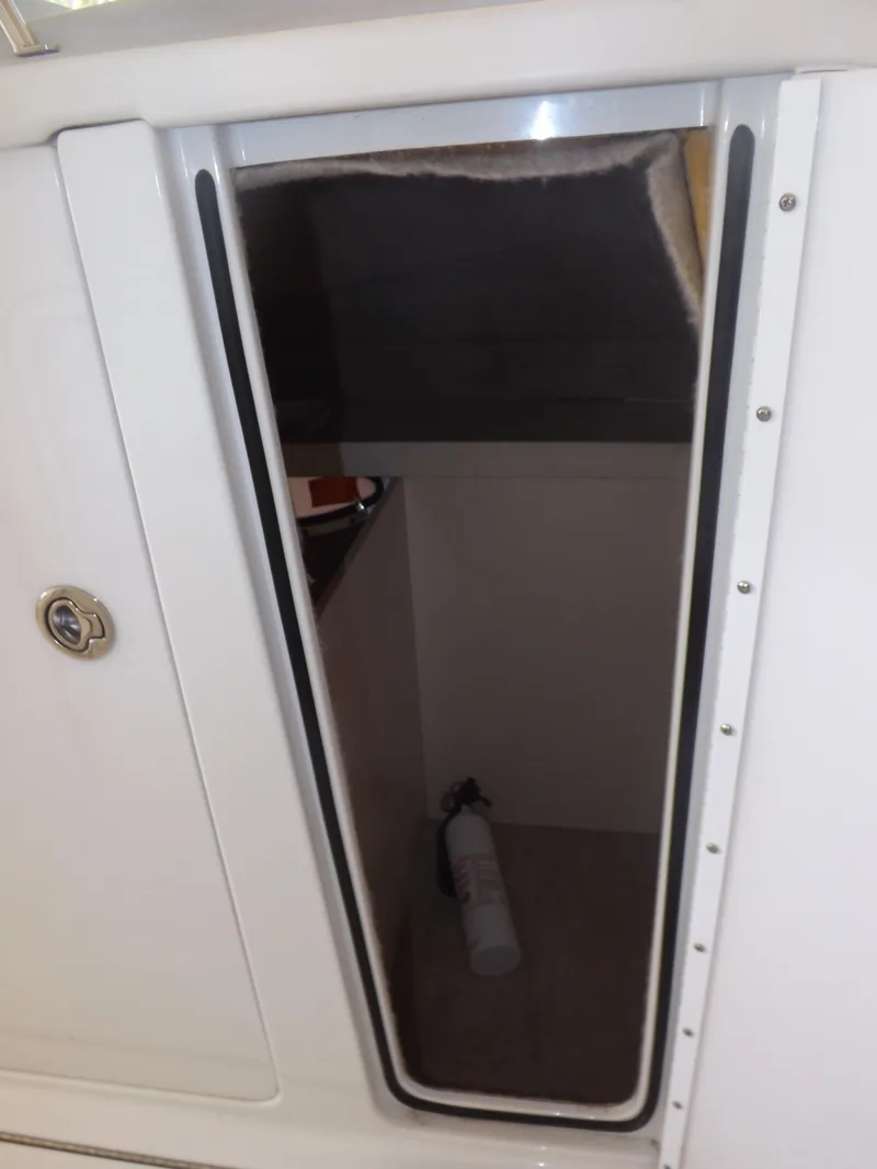 Slide: The Image of Storage compartment on a 2008 Formula 310 Bowrider boat. - 24