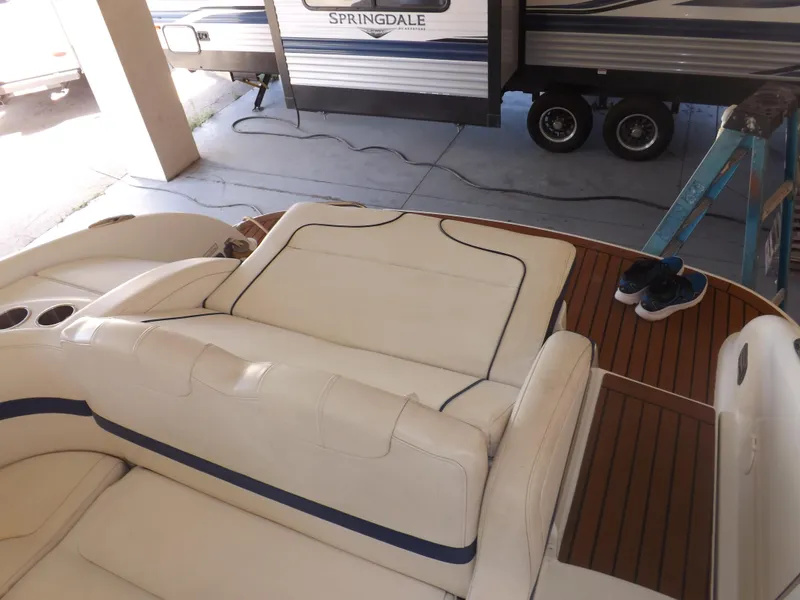 Slide: The Image of 2008 Formula 310 Bowrider interior with white seating and teak flooring. - 29