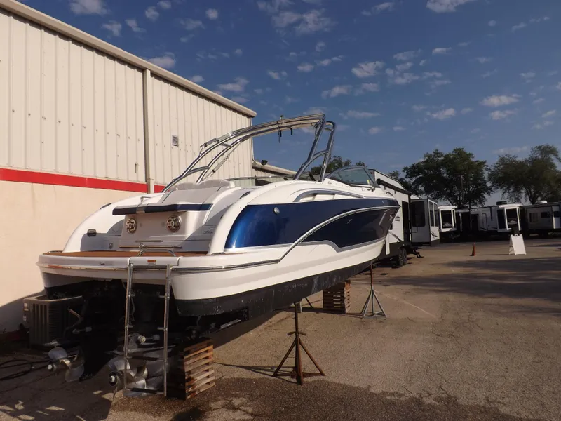 Slide: The Image of 2008 Formula 310 Bowrider boat on stands outside a warehouse. - 3
